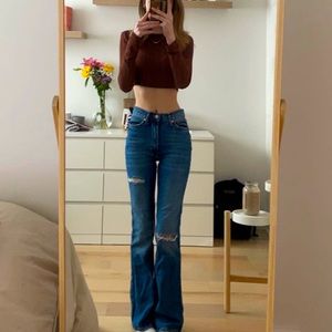 blue dark washed ripped flared jeans